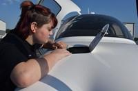 student working on airplane